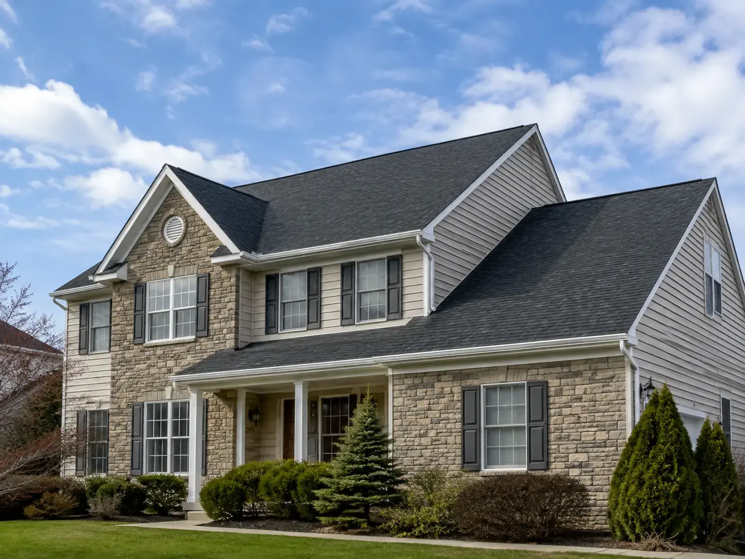 Freshly installed seamless aluminum gutters on a home