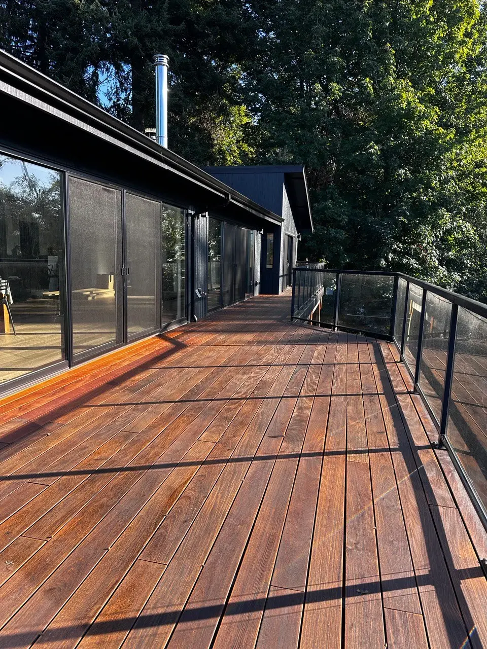 Before and after photos of a wood deck restoration