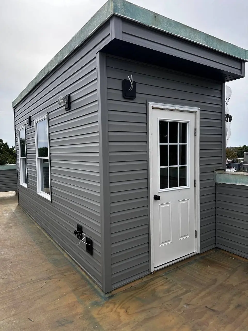 Cedar shake siding installed in a historic-style finish
