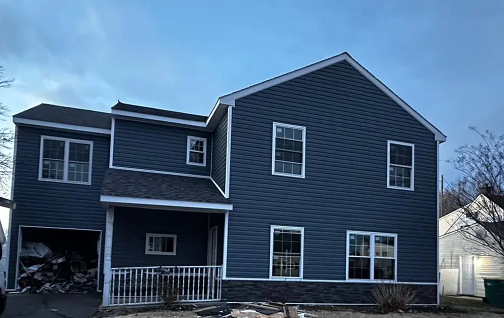 Repair of storm-damaged siding panels on a home exterior