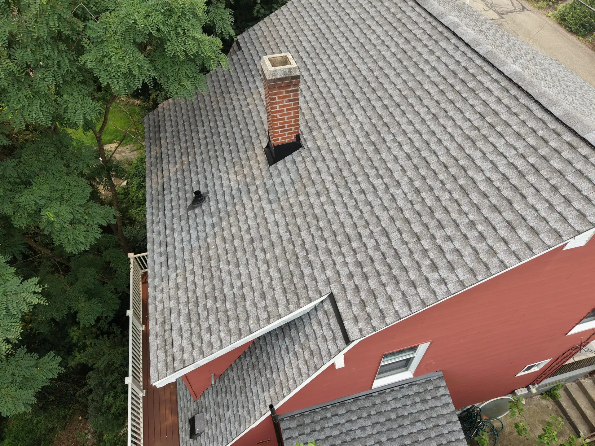 Standing-seam metal roofing panels installed on a residential home — photo 3