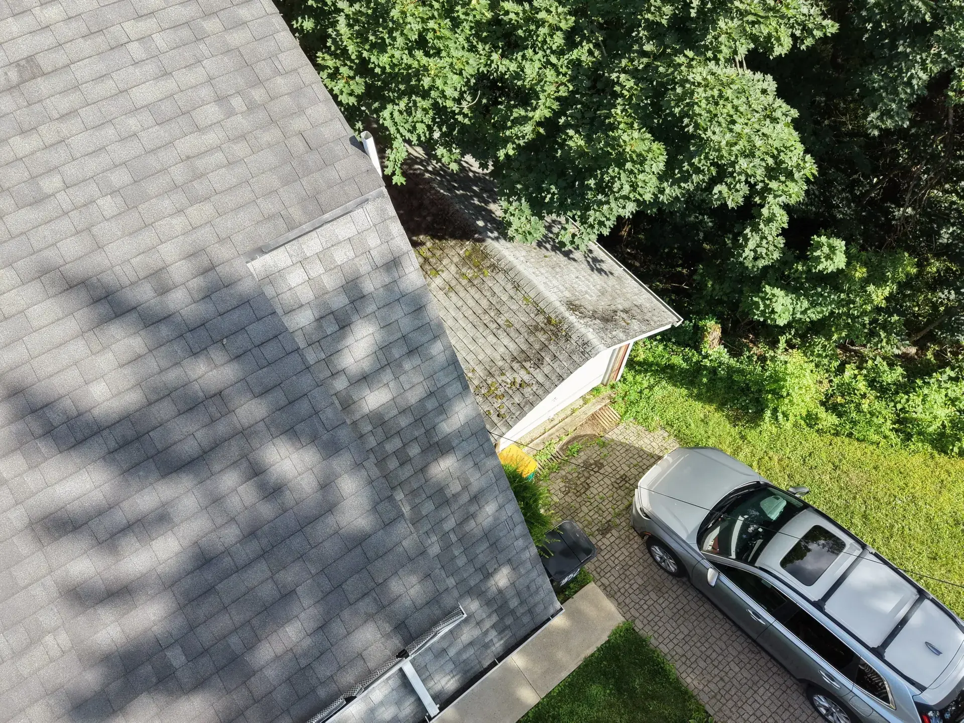 Standing-seam metal roofing panels installed on a residential home — photo 7