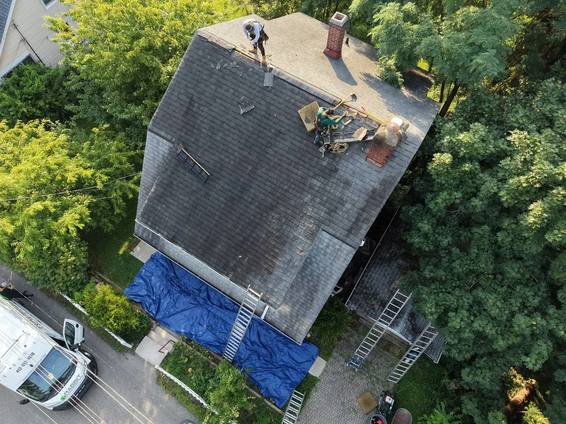 Standing-seam metal roofing panels installed on a residential home — photo 9